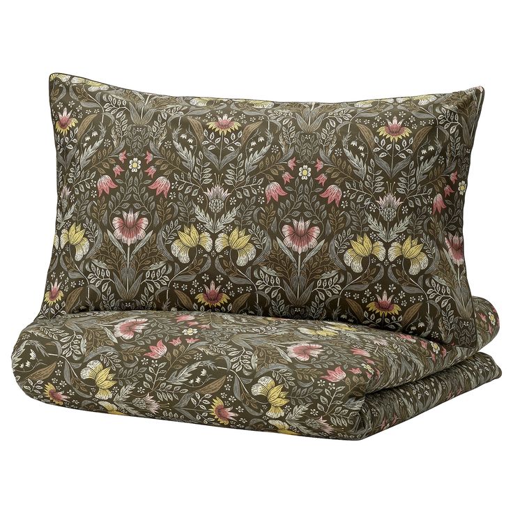 a brown and pink floral print pillow with two matching pillows on the bottom one side