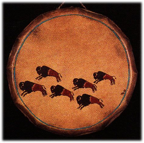 an old drum with dogs painted on it's side and in the shape of a circle