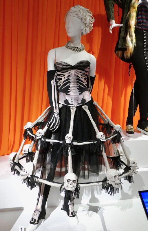 a mannequin dressed in black and white with skeleton decorations