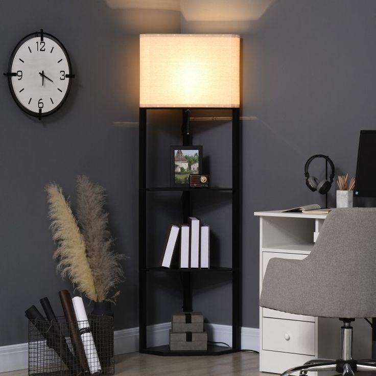 a room with a desk, bookshelf and a clock on the wall above it