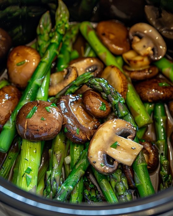 mushrooms and asparagus in a slow cooker