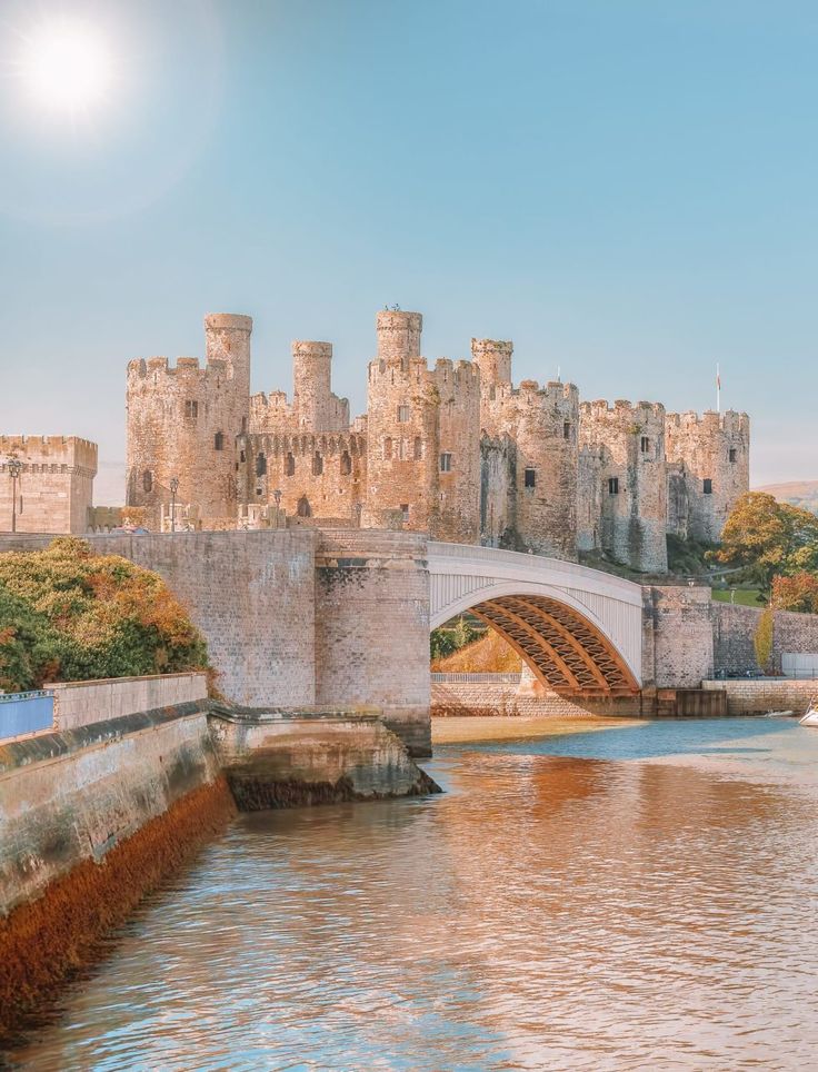 an old castle with a bridge over the water