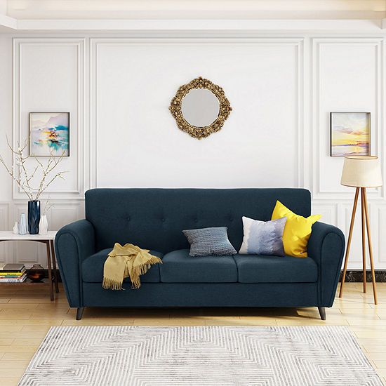 a living room with a blue couch and white walls