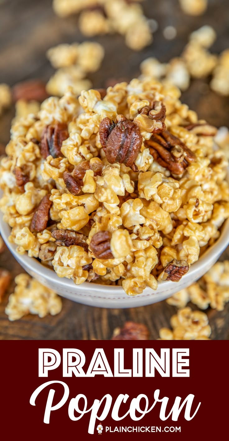 a bowl full of popcorn with pecans in the background and text overlay reading praline popcorn