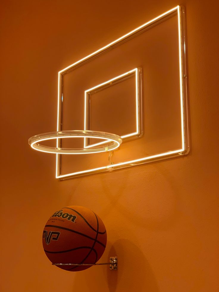 an illuminated basketball hoop hangs on the wall