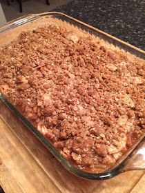 a casserole dish is sitting on a cutting board