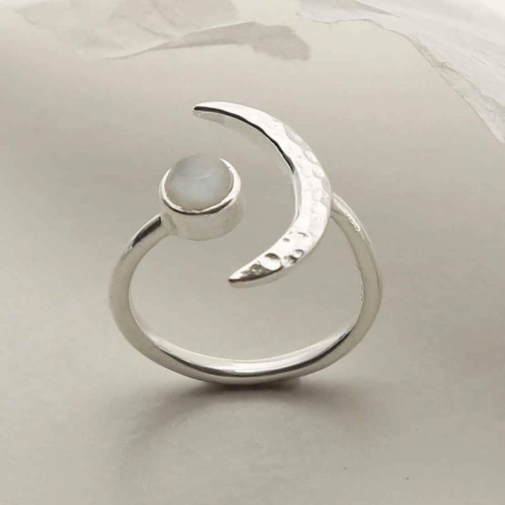 Our Sterling Silver Gemstone Moon Adjustable Ring is an enchanting piece and instant hit. This ring wraps beautifully around the finger, with a gemstone on one side and a hammered silver crescent on the other. Silver Adjustable Ring, Silversmith Rings, Sterling Silver Moonstone Ring, Ring Wraps, Silversmith Jewelry, Silversmithing Jewelry, Minimalist Silver Ring, Jewelry Stones, Metal Smithing