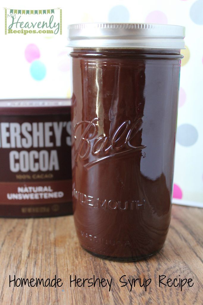 a jar of chocolate sits on a table next to a box of hershey cocoa