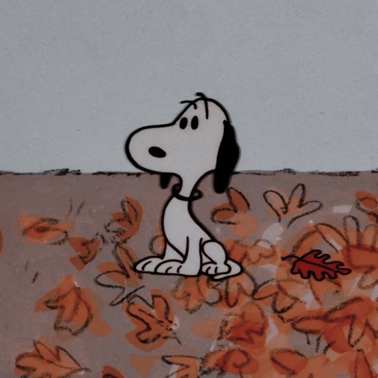 a cartoon dog sitting on top of a pile of leaves next to a leaf filled wall