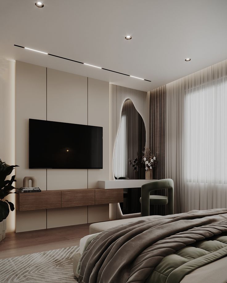 a bedroom with a large flat screen tv mounted on the wall