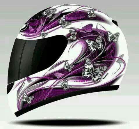 the helmet is decorated with purple and white designs