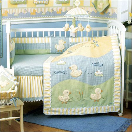 a baby's room is decorated in blue and yellow