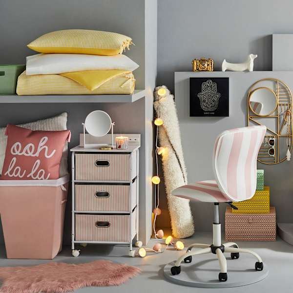 a room filled with lots of furniture and pillows on top of it's shelves