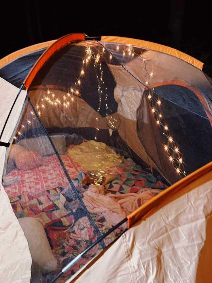 the inside of a tent with lights on it