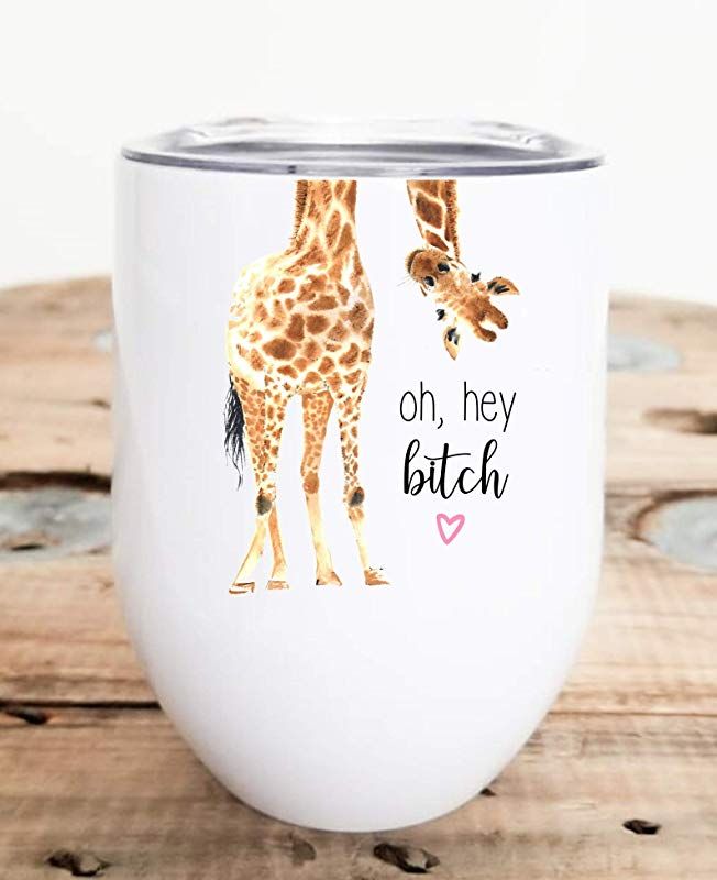 two giraffes are standing next to each other on a white wine cup