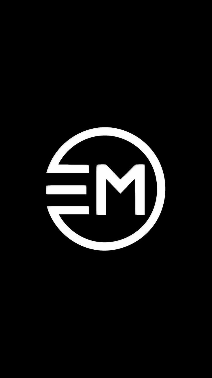 the letter m is made up of two white letters in a circle on a black background