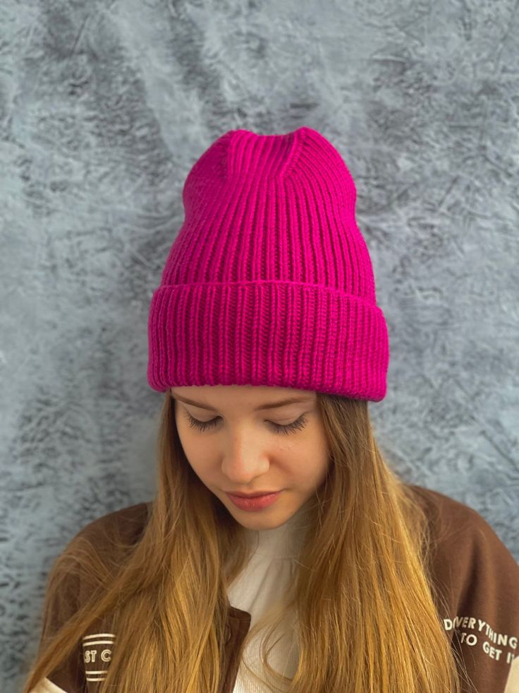 "Pink hat Neon pink beanie Lightweight and super soft hat knitted from merino wool in two yarns  Yarn manufacturer: Lana Gatto You can choose the pattern: plain, 1x1 rib, 2x2 rib. Temperature range: down to -15 degrees   Hat - Adult medium size - 22\" (56cm). ▬ SIZE AND FITS FOR. - 52-54 cm (20.47-21.25 inches) - 54-56 cm (21.25-22.04 inches) - 56-58 cm (22.04-22.83 inches) Custom sizes available upon request You can order it in any other size or color with different stripes  Various colors are in the attached file. Color as pictured on request. On order within 7-14 days. ▬ Material: 100% merino wool. ▬ CARE ▬ Hand wash or delicate wash only at 30o with shampoo, dry on a flat surface. All items are pre-washed. ▬ DELIVERY - Gift wrap 1-3 business days for delivery Express shipments availabl Warm Solid Color Crochet Hat, Trendy Ribbed Cap, Cold Weather Ribbed Hats, Knitted Beanie One Size Fits Most, Trendy Knitted Hat, Trendy Knitted Solid Color Hats, Casual Purple Knitted Beanie, Trendy Solid Color Knitted Hats, Soft Knit Bonnet Cap