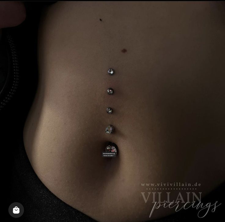 a woman's stomach with several diamonds on it