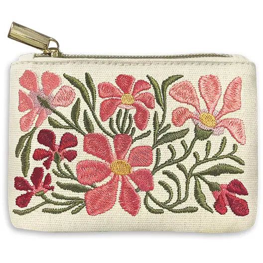 a white purse with pink flowers on it