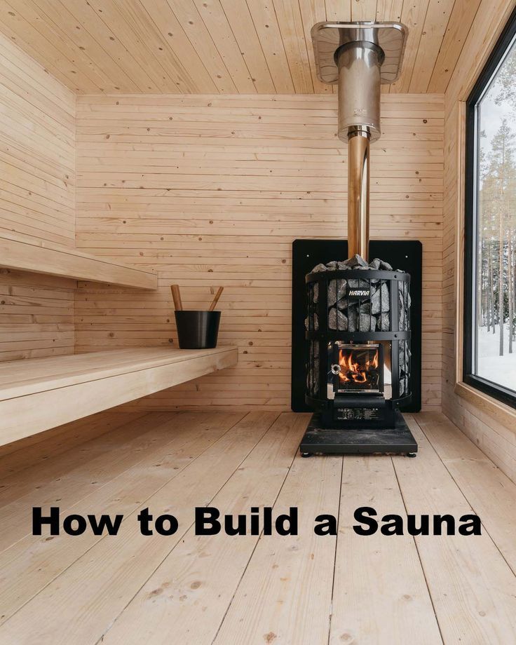 a wood burning stove sitting inside of a wooden room next to a window with the words how to build a sauna written on it