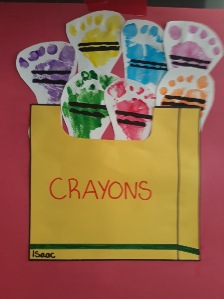 a paper bag with hand prints on it and the words crayons written in red