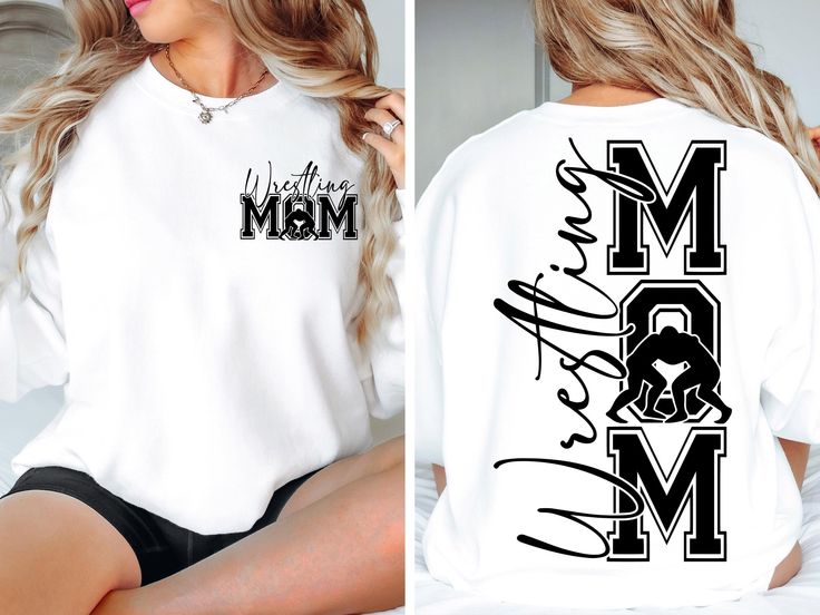 a woman sitting on top of a bed wearing a white shirt with the word mom printed on it