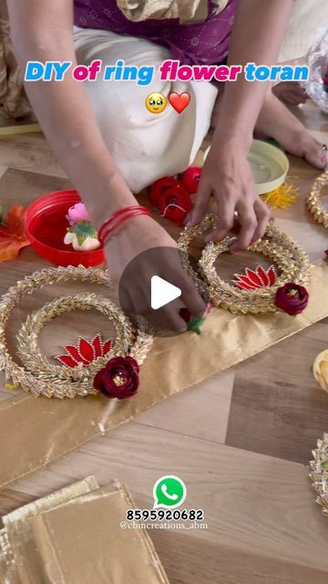 a woman is making decorative items on the floor