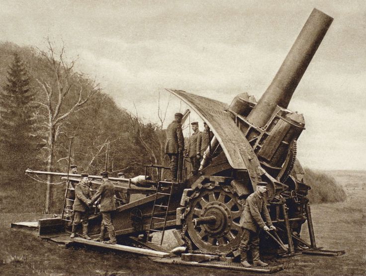 an old black and white photo of men working on a large machine in the woods