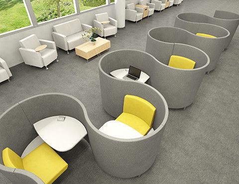 an office with yellow and gray furniture in it