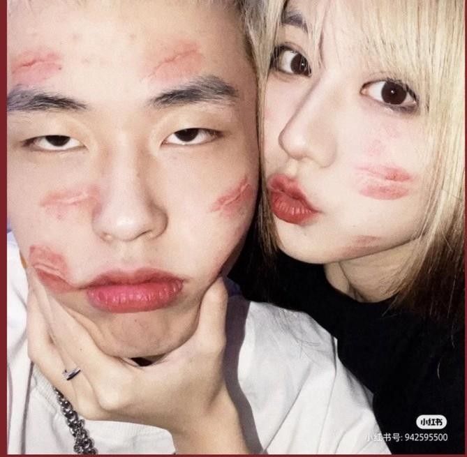 two people with makeup on their faces posing for the camera