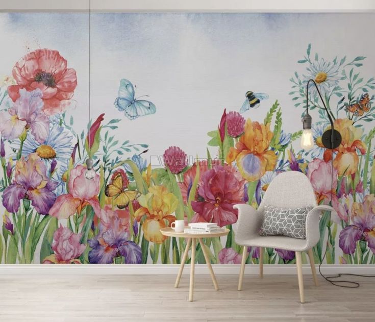 a wall mural with flowers and butterflies painted on it in a living room or bedroom