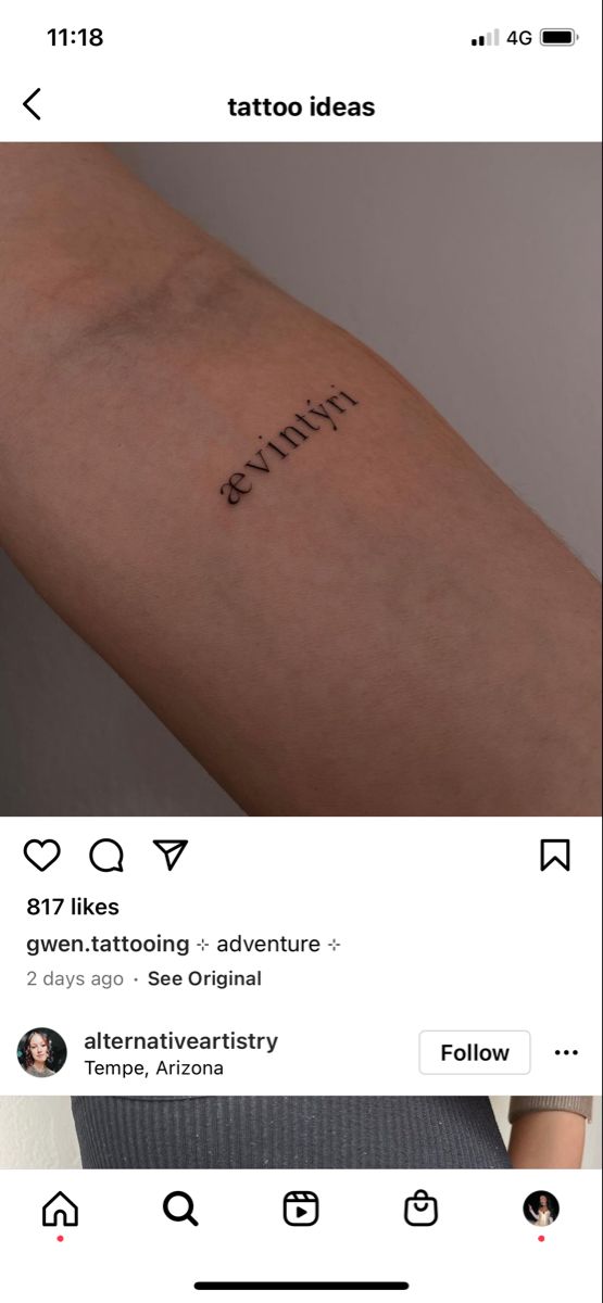 an image of someone's arm with the word tattoo on it