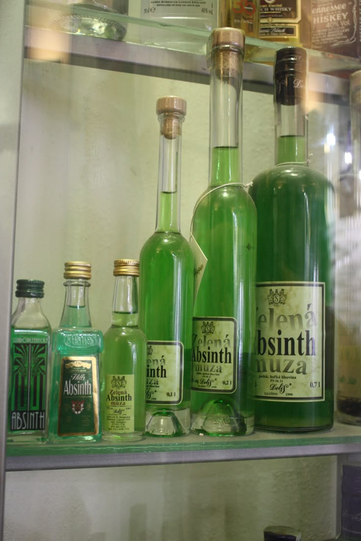 many different types of bottles on a shelf