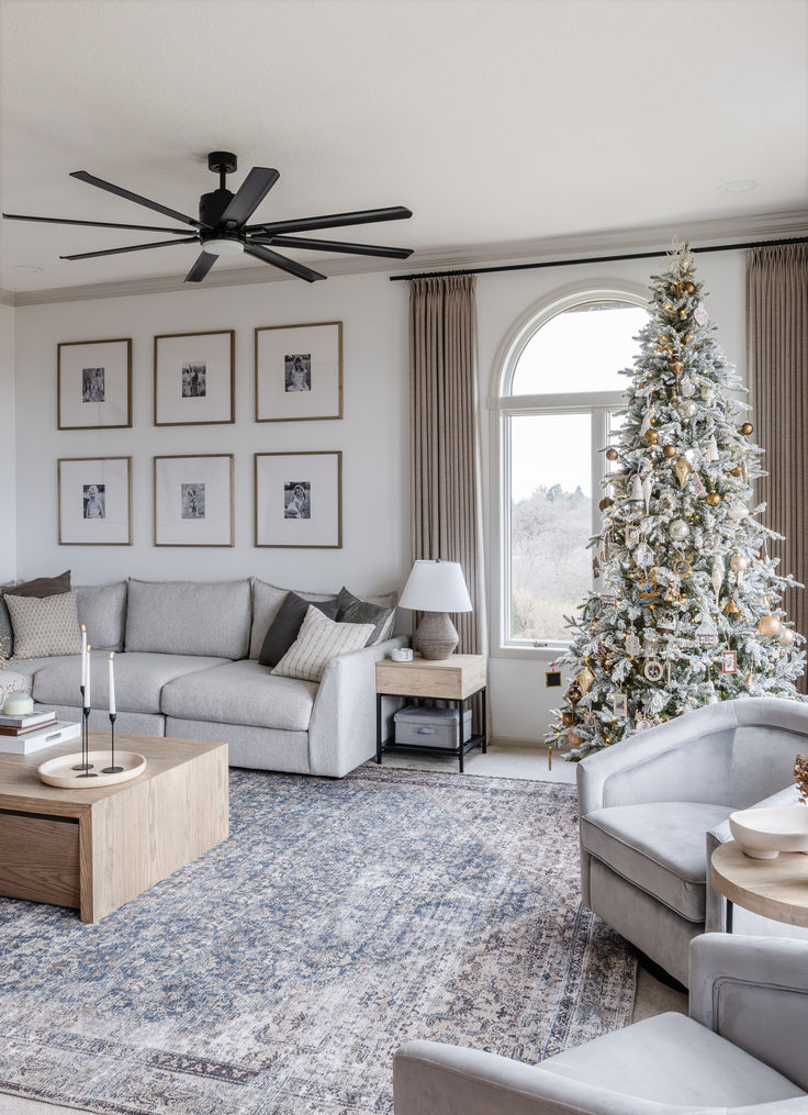 Beautiful airy home featuring a cozy sectional, two accent chairs, two end tables, a coffee table, and a Christmas tree. Neutral Sectional, Basement Update, Grey Walls Living Room, Christmas Decor Inspiration, Peppermint Tea, Modern Cottage, Movie Nights, Luxury Sofa, Grey Walls