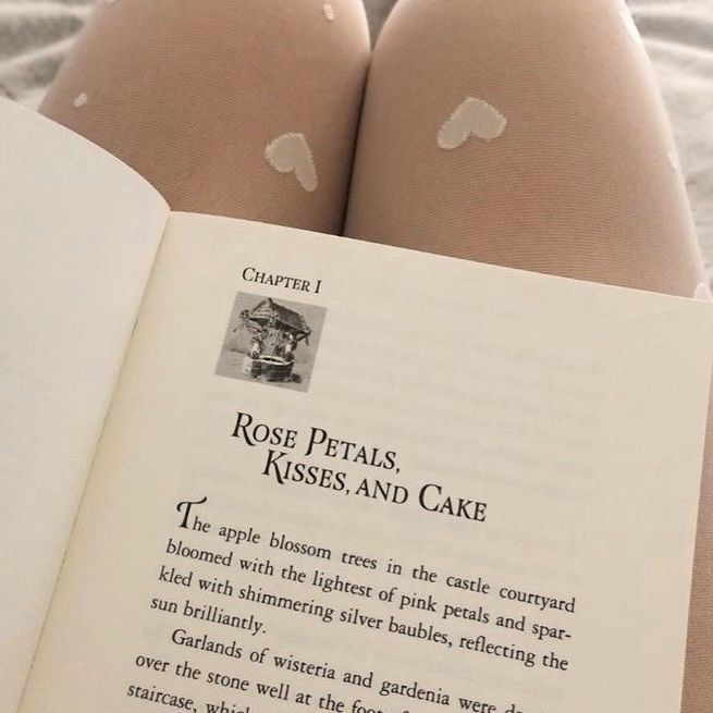 a person laying down reading a book with white patches on their butts and legs