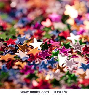 many different colored stars are scattered on the ground