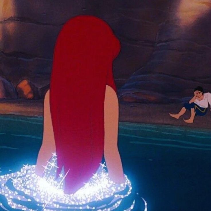 the little mermaid is sitting in the water with her back turned to look like she's floating