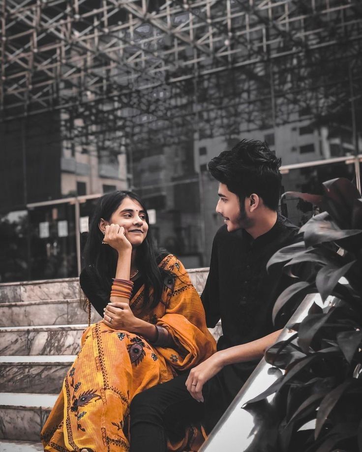 a man and woman sitting next to each other