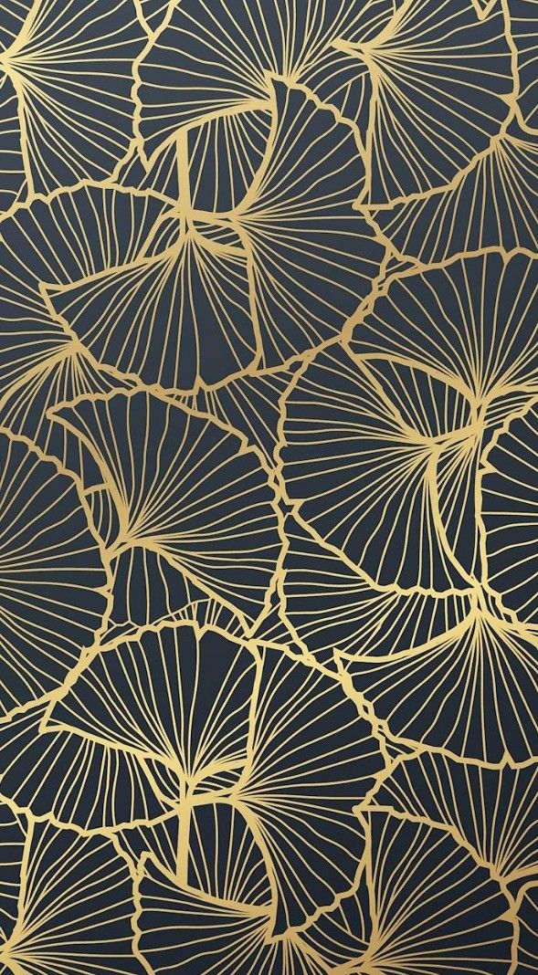 an intricate gold and black wallpaper with large leaves on the front, along with dark blue background