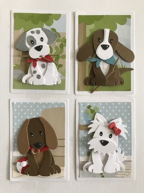 four cards with dogs on them in the shape of magnets that are cut out of paper