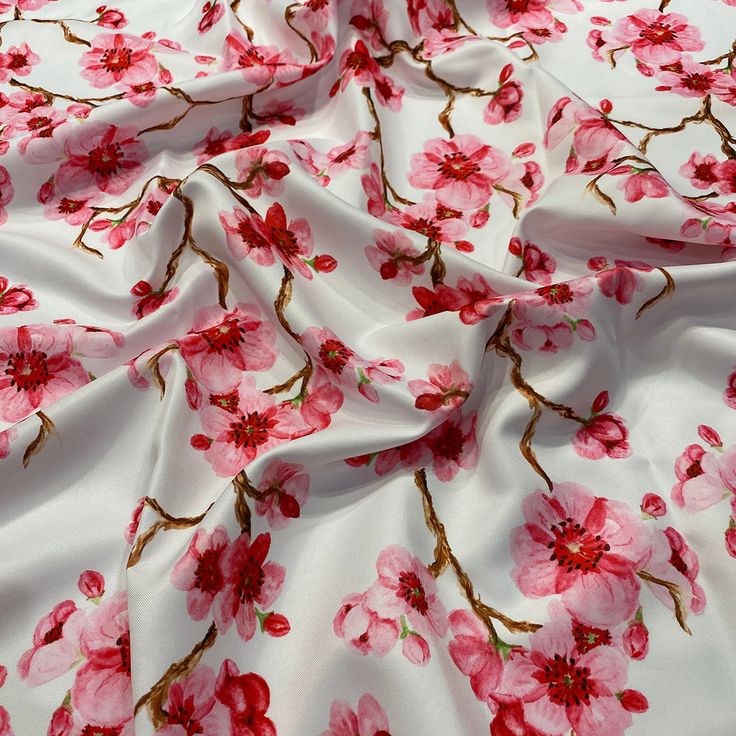 the fabric has pink flowers on it