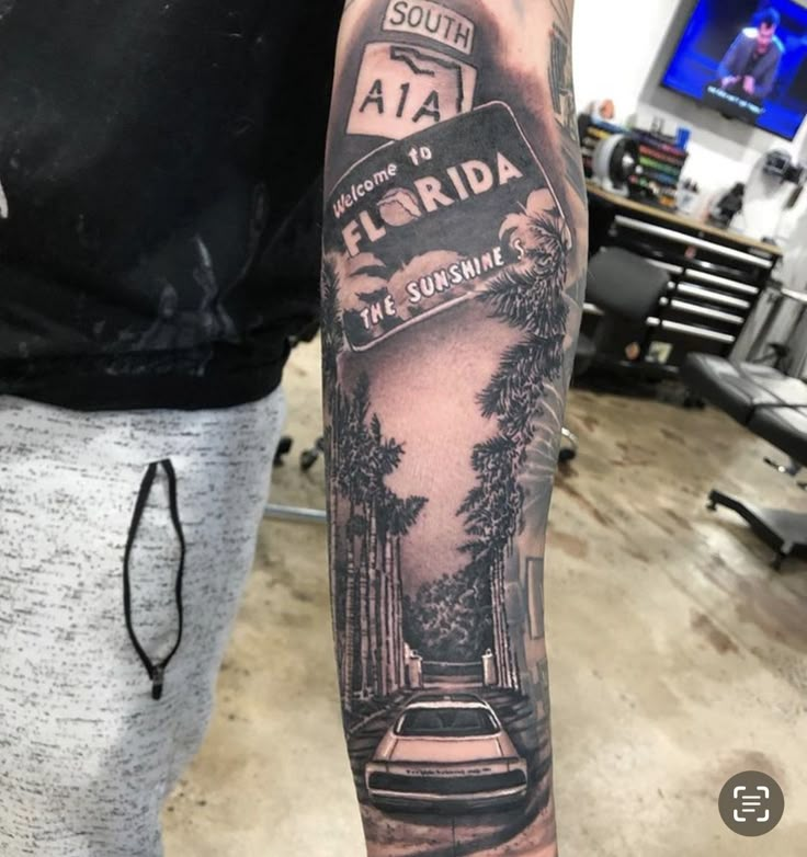 a man with a black and white tattoo on his arm that reads, florida the sunshine shines