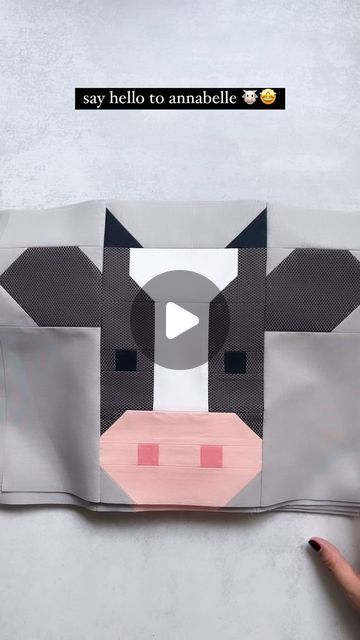 someone is making a cow out of paper