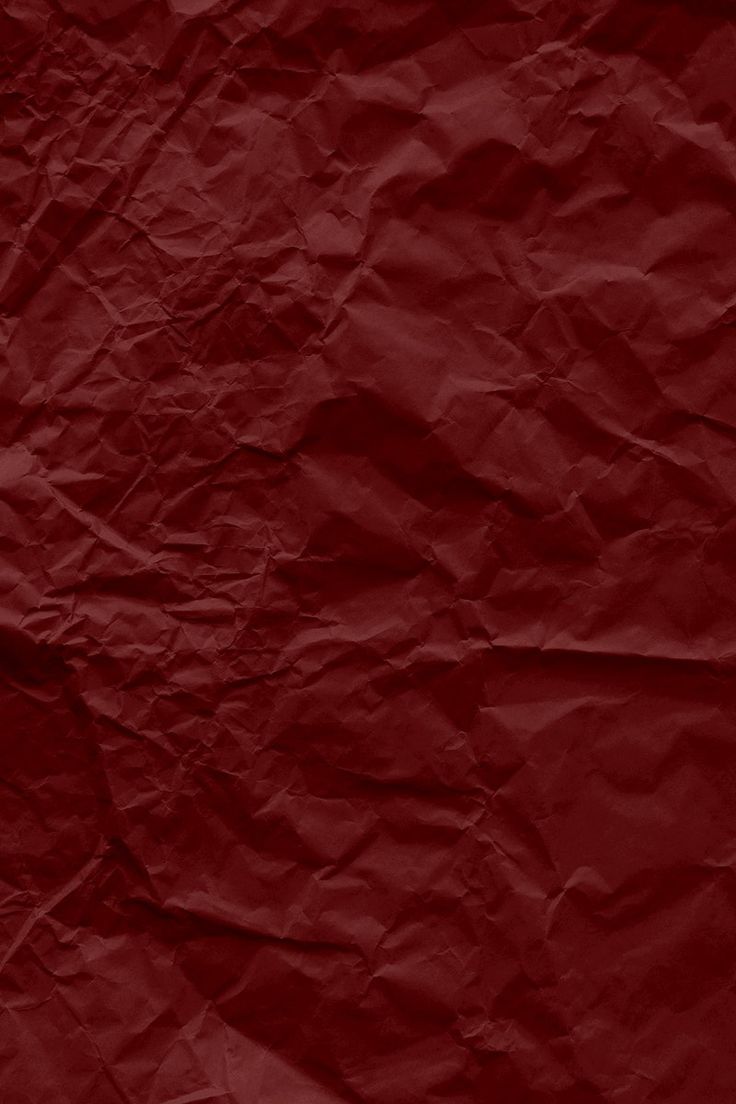 a red crumpled paper textured background that looks like it could be used as a wallpaper