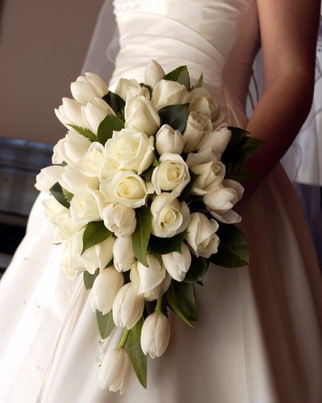 a bridal bouquet with white flowers on it's wedding day is seen in this instagram photo