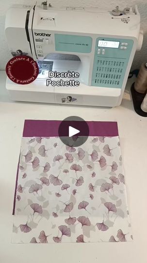 the sewing machine is next to an envelope with butterflies printed on it, along with a video about how to sew