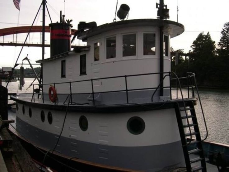 a large white boat sitting next to a dock