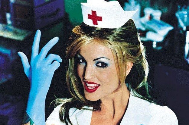 a woman in a nurse outfit holding up her hand