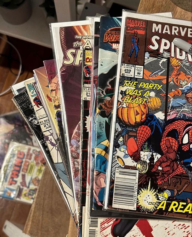 several comics are stacked on top of each other