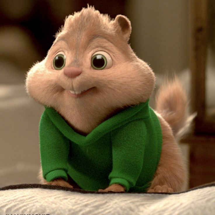 the chipmunz character is sitting on top of a bed